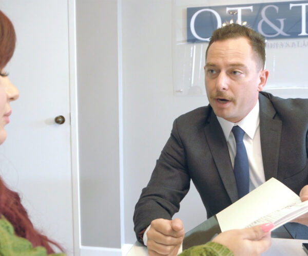 Lawyer consulting with client in office meeting