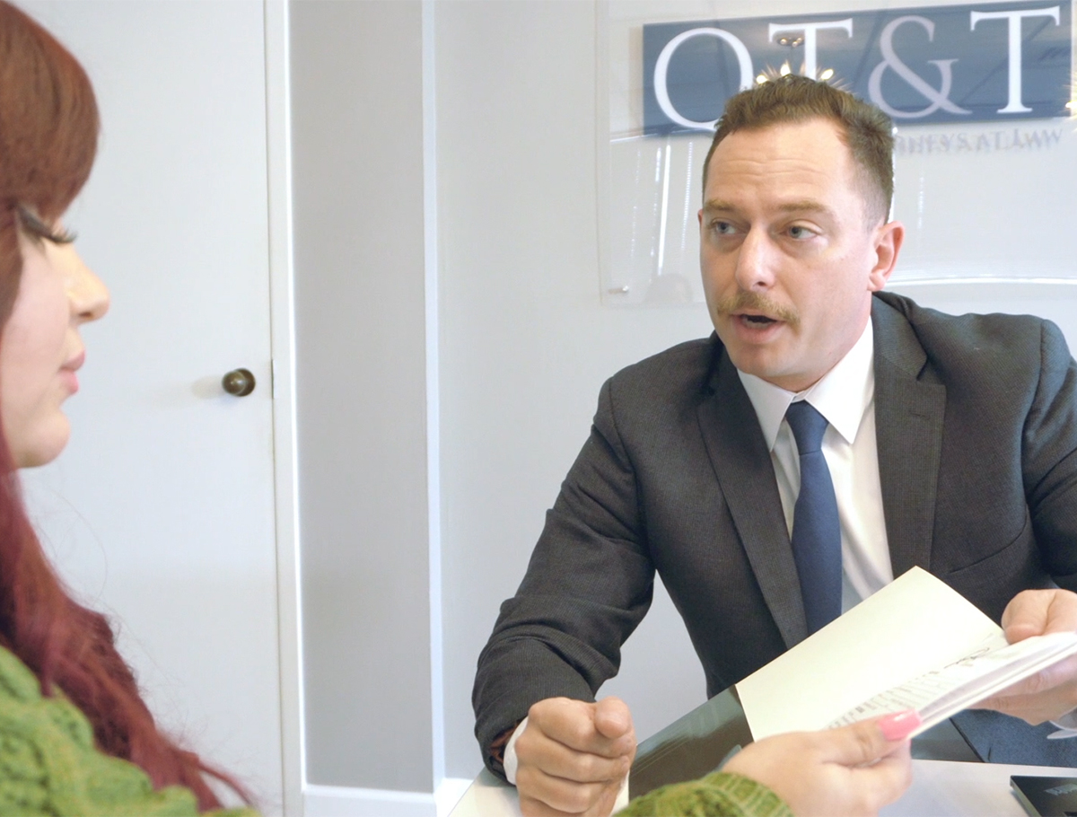 Lawyer consulting with client in office meeting