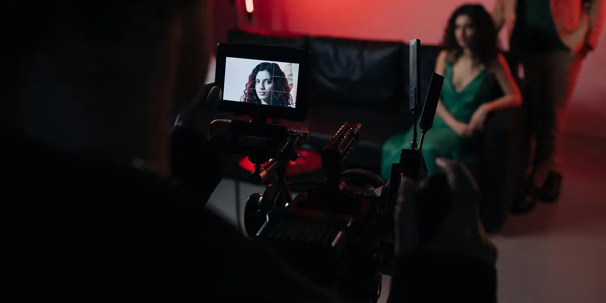 Woman on camera screen during film production shoot