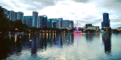 Lake Eola with the downtown Orlando skyline reflected in the water.