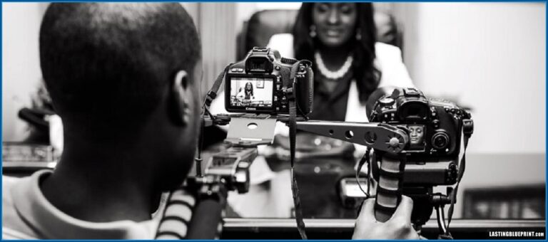 Videographer operating a two-camera setup during an attorney interview.