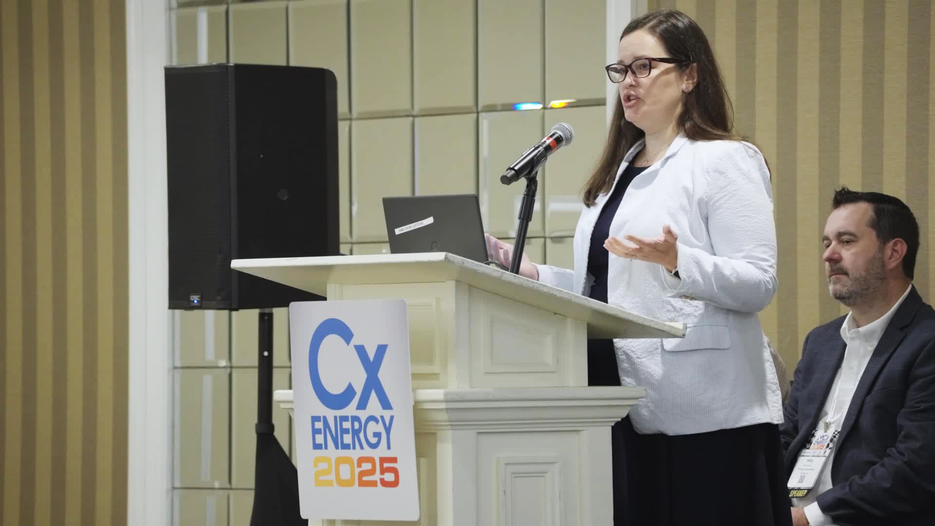 Conference speaker presenting at the CxEnergy 2025 conference