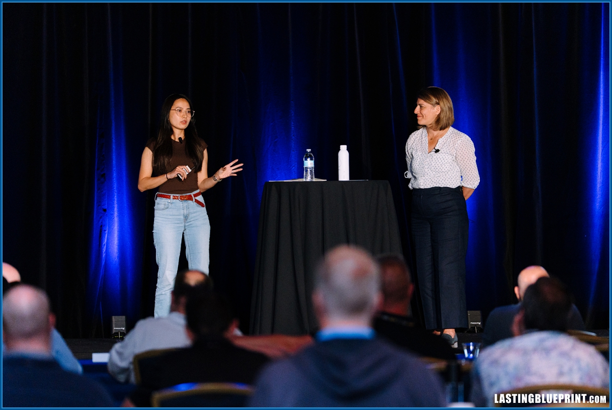 Speakers presenting on stage during a conference session at disney’s contemporary resort in orlando.