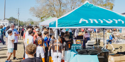 Sponsor tent at a youth baseball event in Orlando.