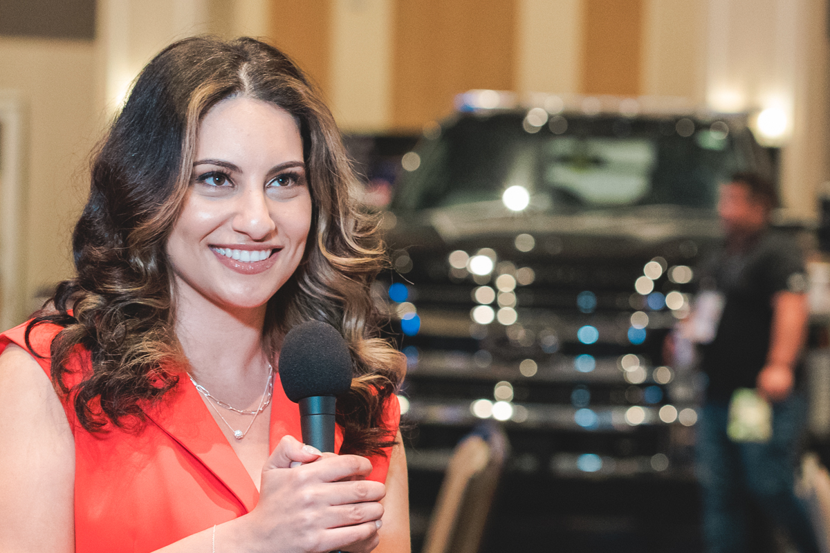An attendee speaks on camera during a testimonial interview at rosen shingle creek.