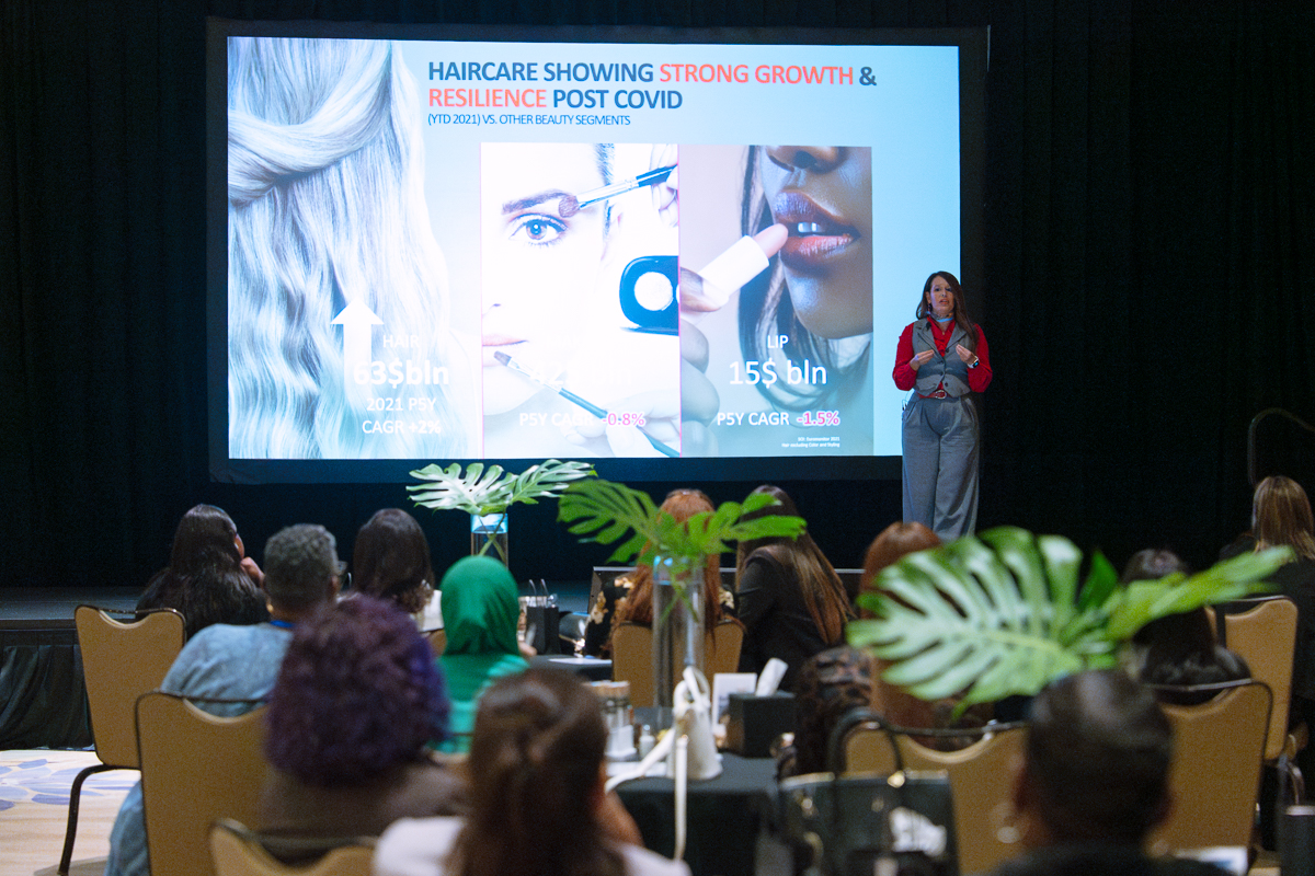 Beauty seminar presenter speaking to an audience at jw marriott orlando, grande lakes