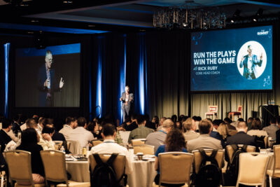 Keynote speaker addressing a conference audience at Omni Orlando Resort at ChampionsGate