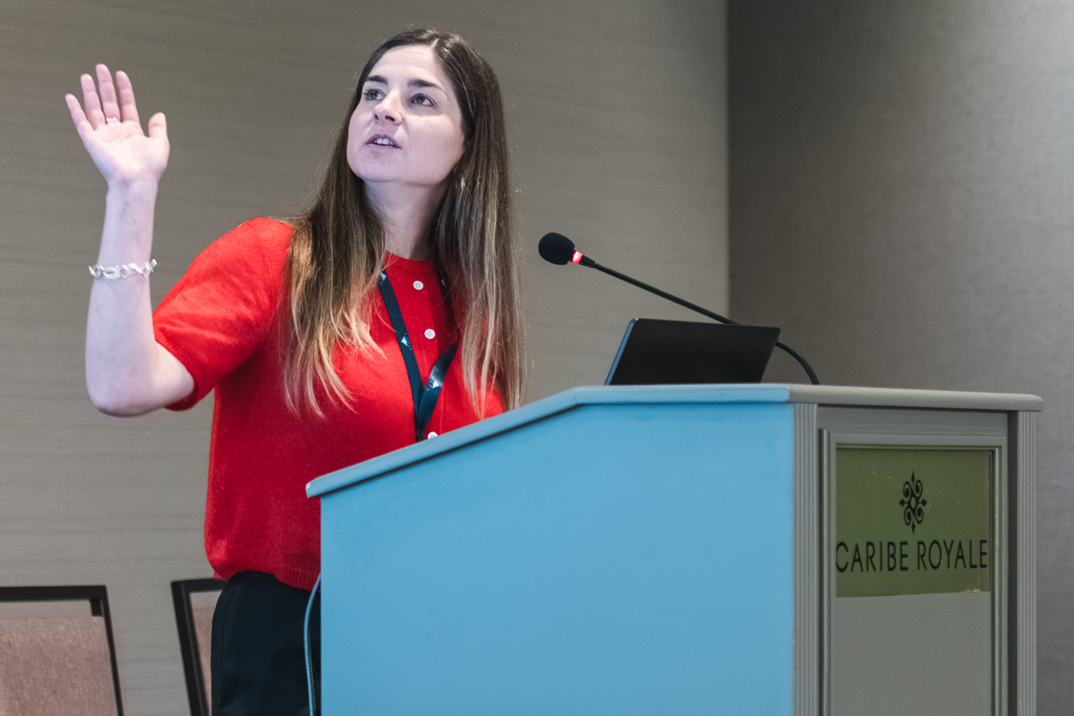 Conference presenter speaking at a podium at caribe royale orlando