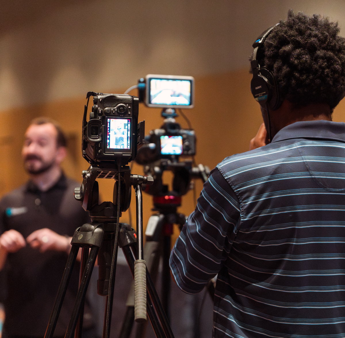 Event videographer recording a training course promotional interview with two cameras at disney’s contemporary resort.