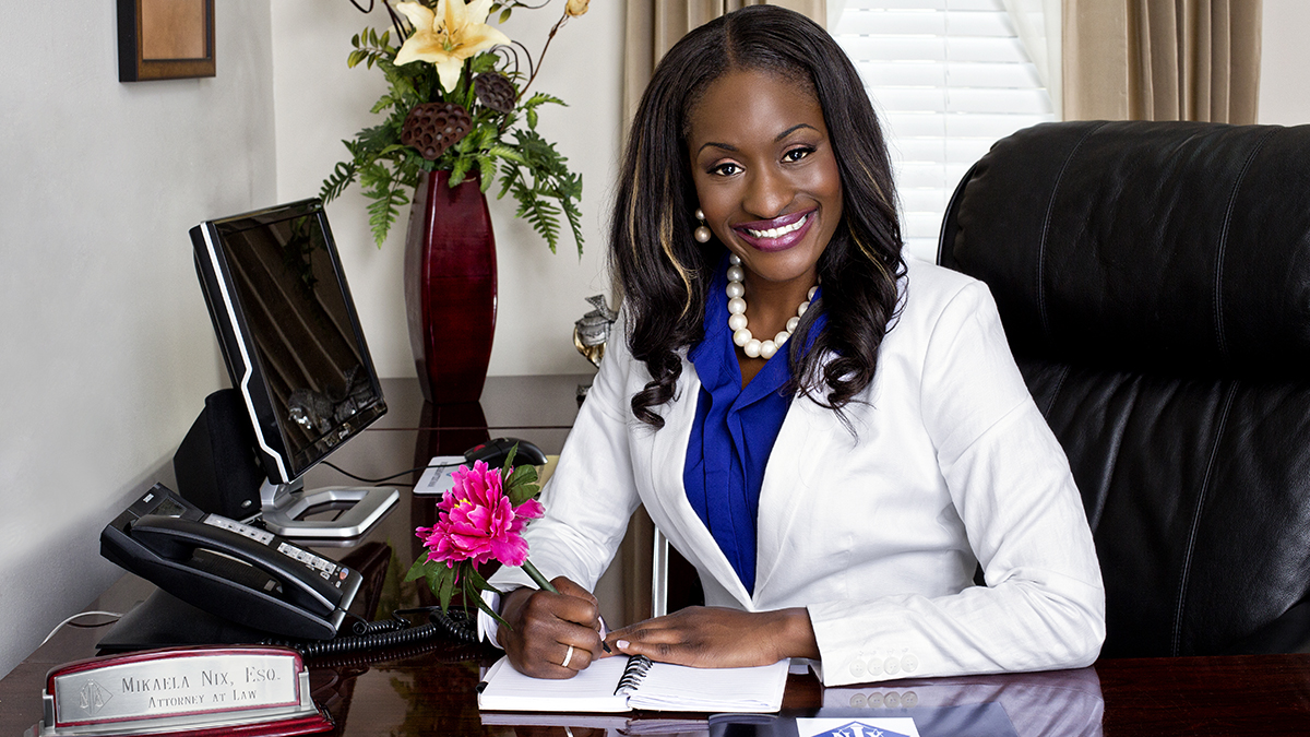 Mikaela nix seated at her desk for an attorney profile video production project
