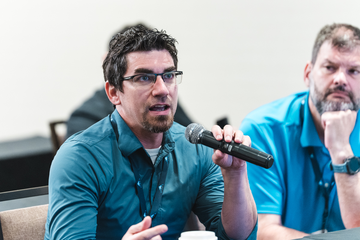 Attendee asking a question during a conference at caribe royale orlando