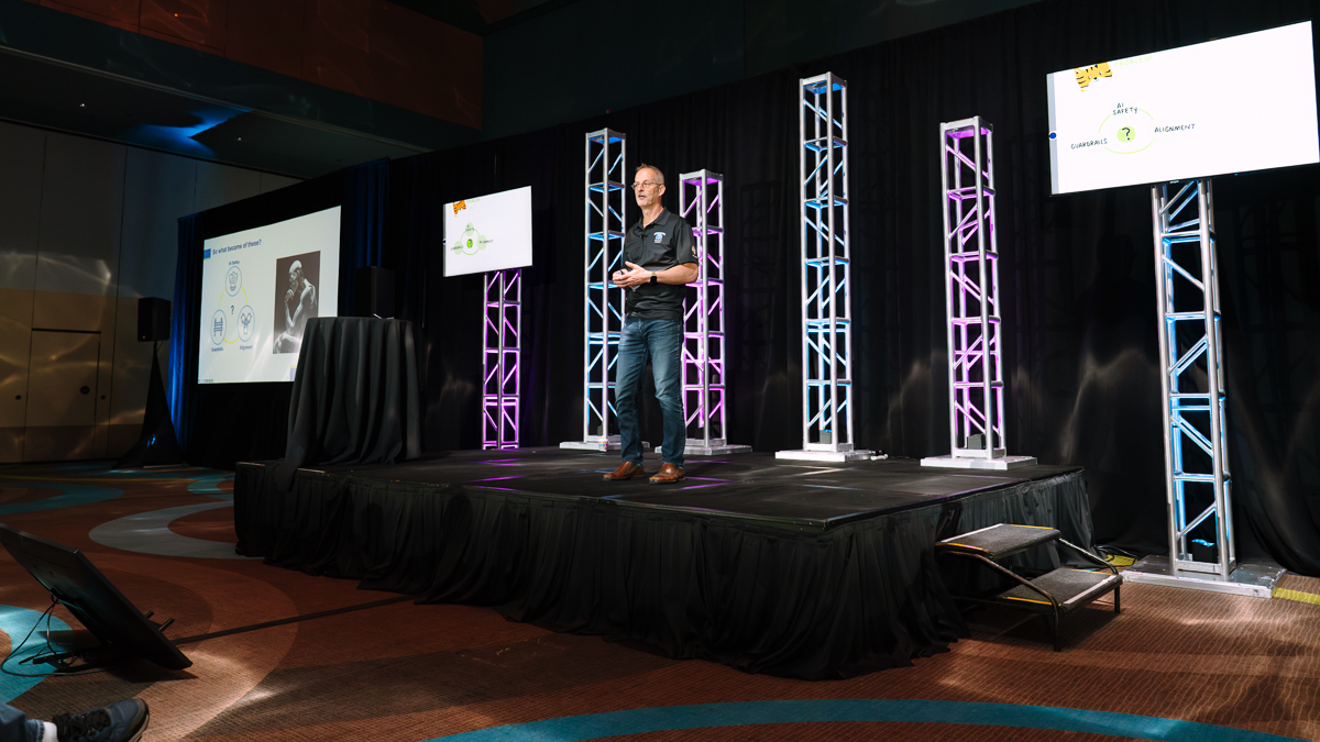 Keynote presenter on stage during a summit at disney’s contemporary resort