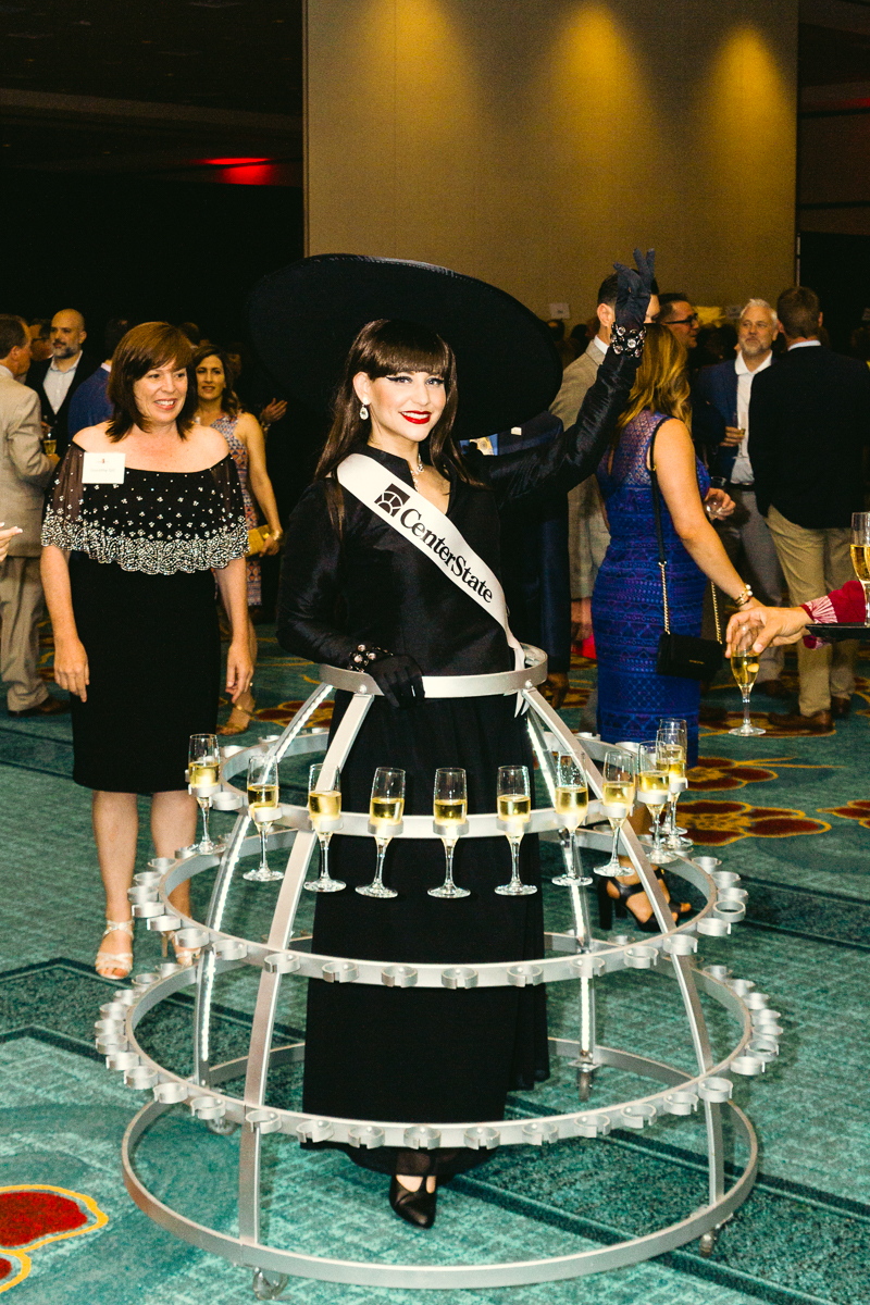 Champagne server in costume during wine quest at loews royal pacific resort
