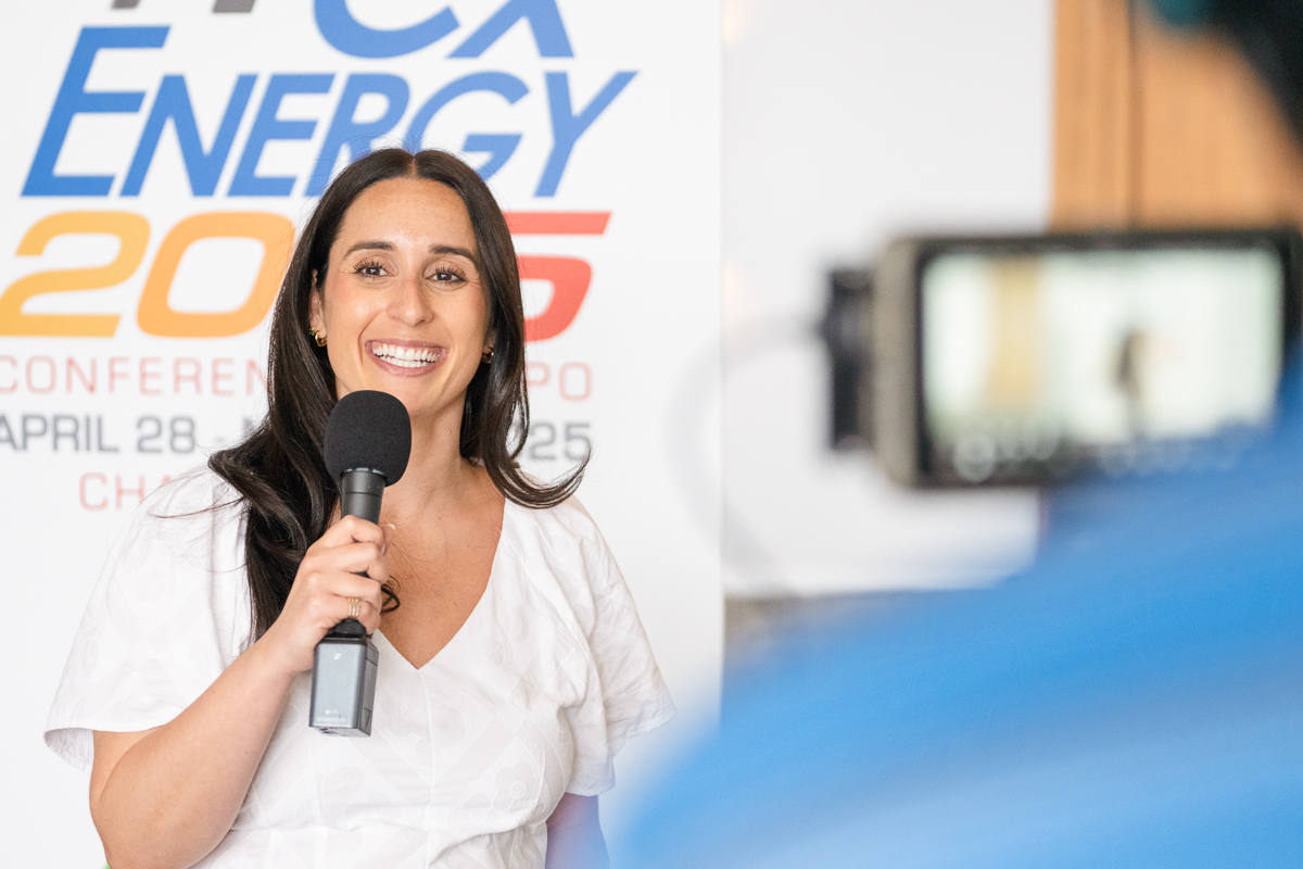 Woman recording a testimonial at the cxenergy conference in orlando