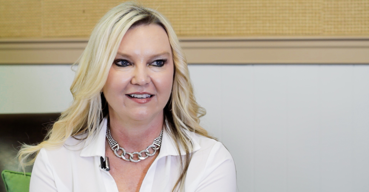 Real estate agent giving a customer testimonial during an on-camera interview.