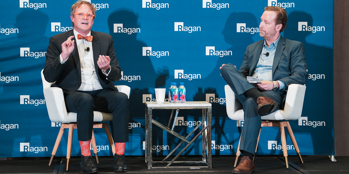 Two speakers onstage during a ragan communications conference at walt disney world dolphin resort