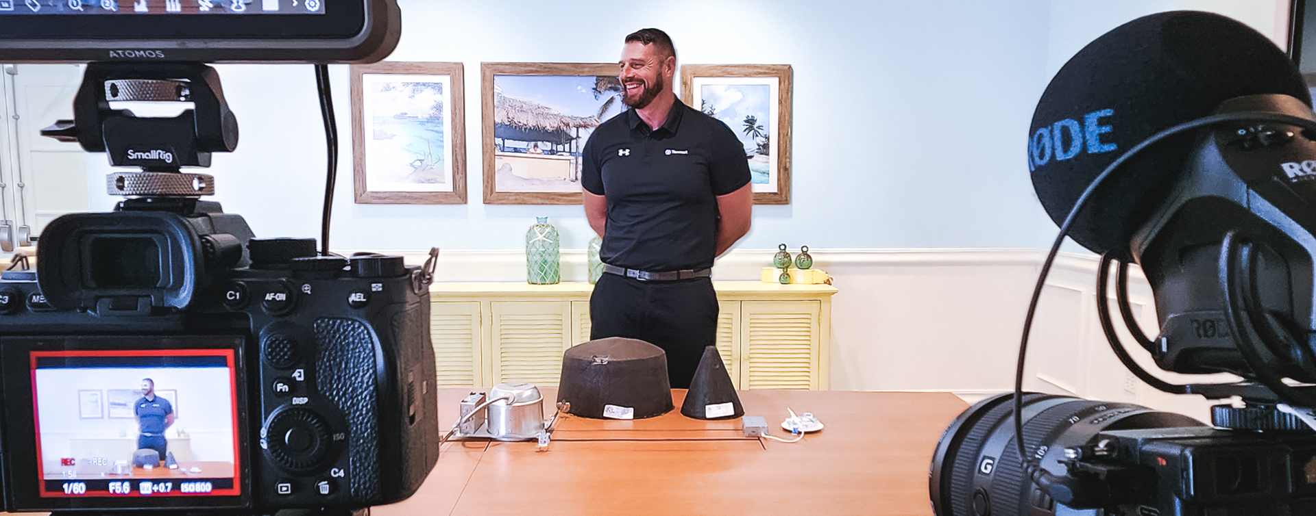 Two cameras filming a presenter during a training video at margaritaville resort orlando.