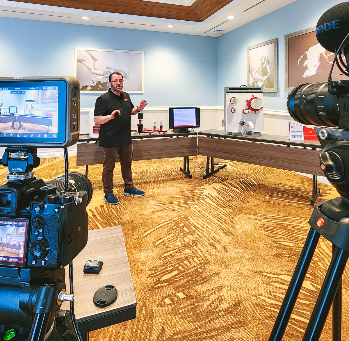 Multi-camera video production setup filming a presenter during a technical training demonstration at margaritaville resort orlando.
