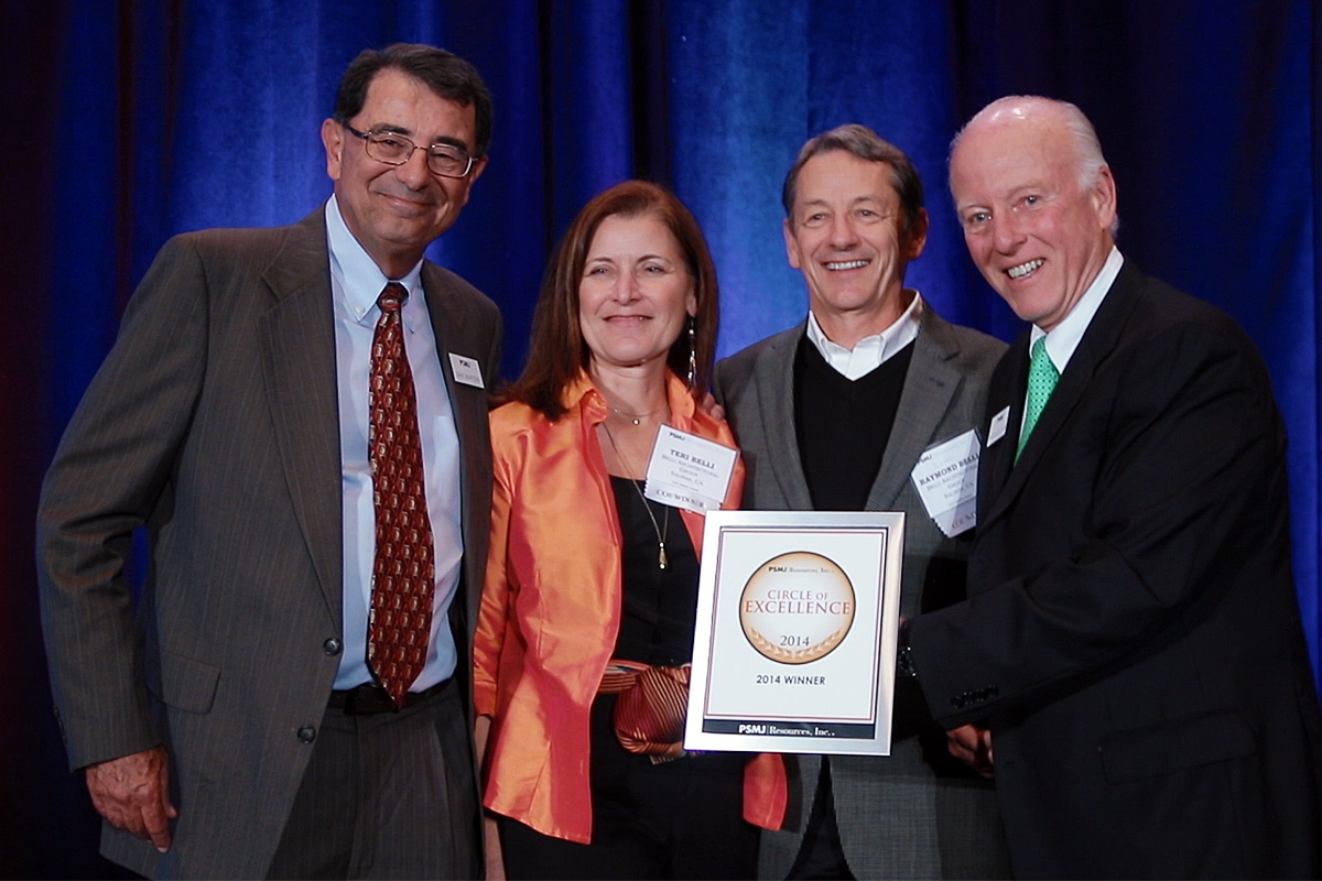Award recipients pose with a circle of excellence plaque during the psmj a/e/c industry summit at omni orlando resort at championsgate.