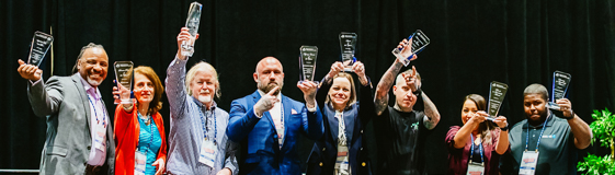 Award recipients posing for a group photo at rosen shingle creek in orlando.