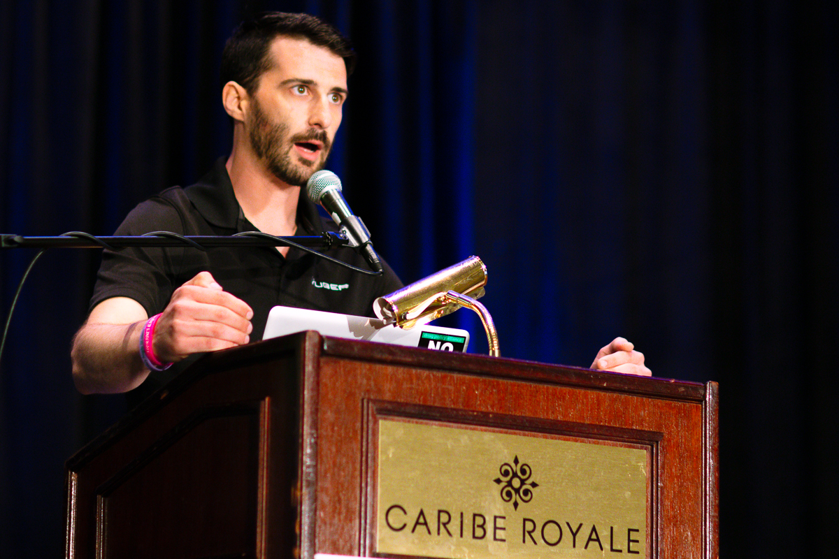 Presenter speaking from the caribe royale podium during cannabiz day orlando