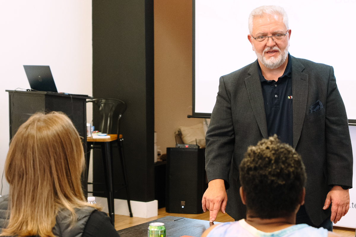 Instructor leading a training workshop for a small group.