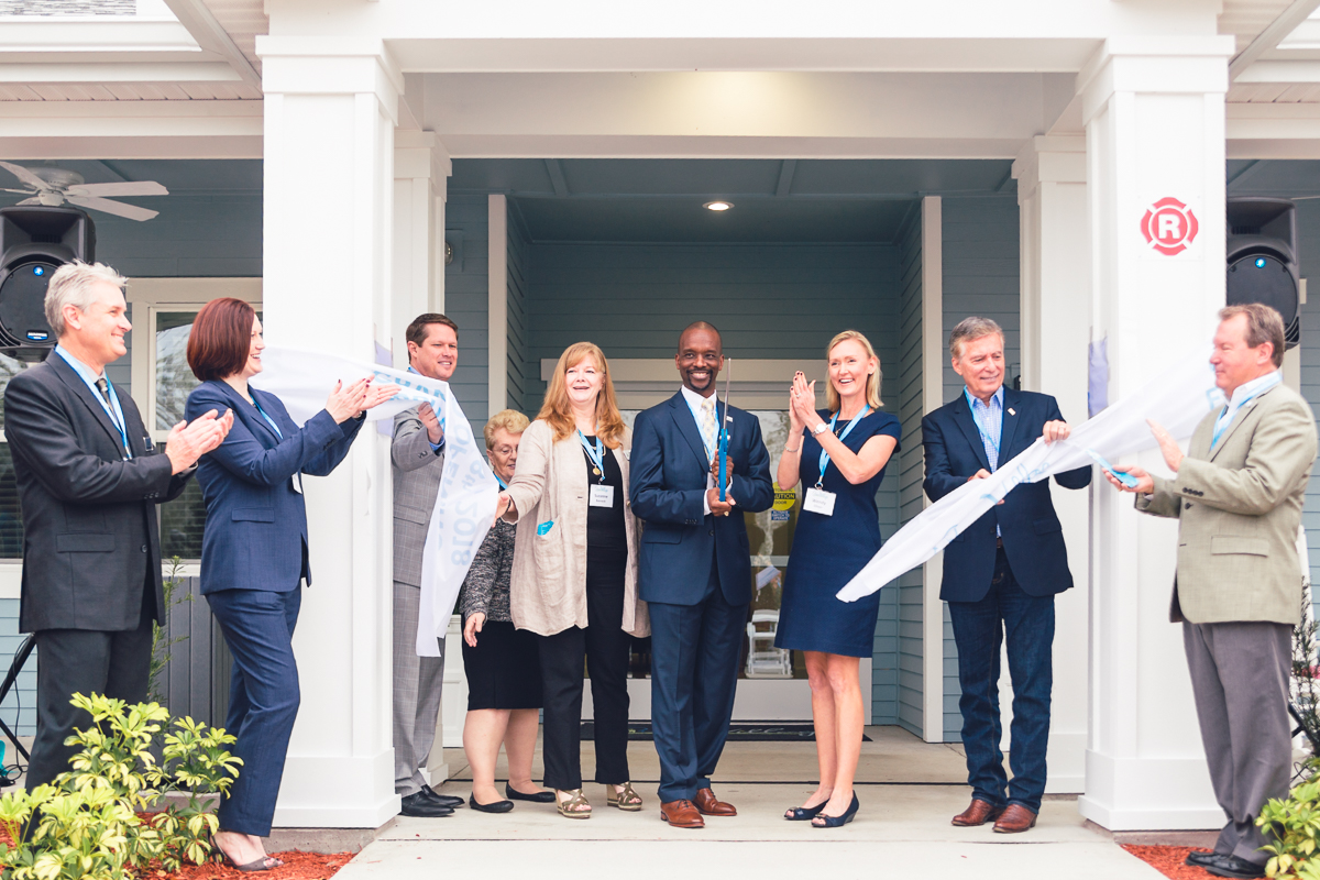 Quest village leaders and guests during the grand opening ribbon-cutting ceremony in orlando.