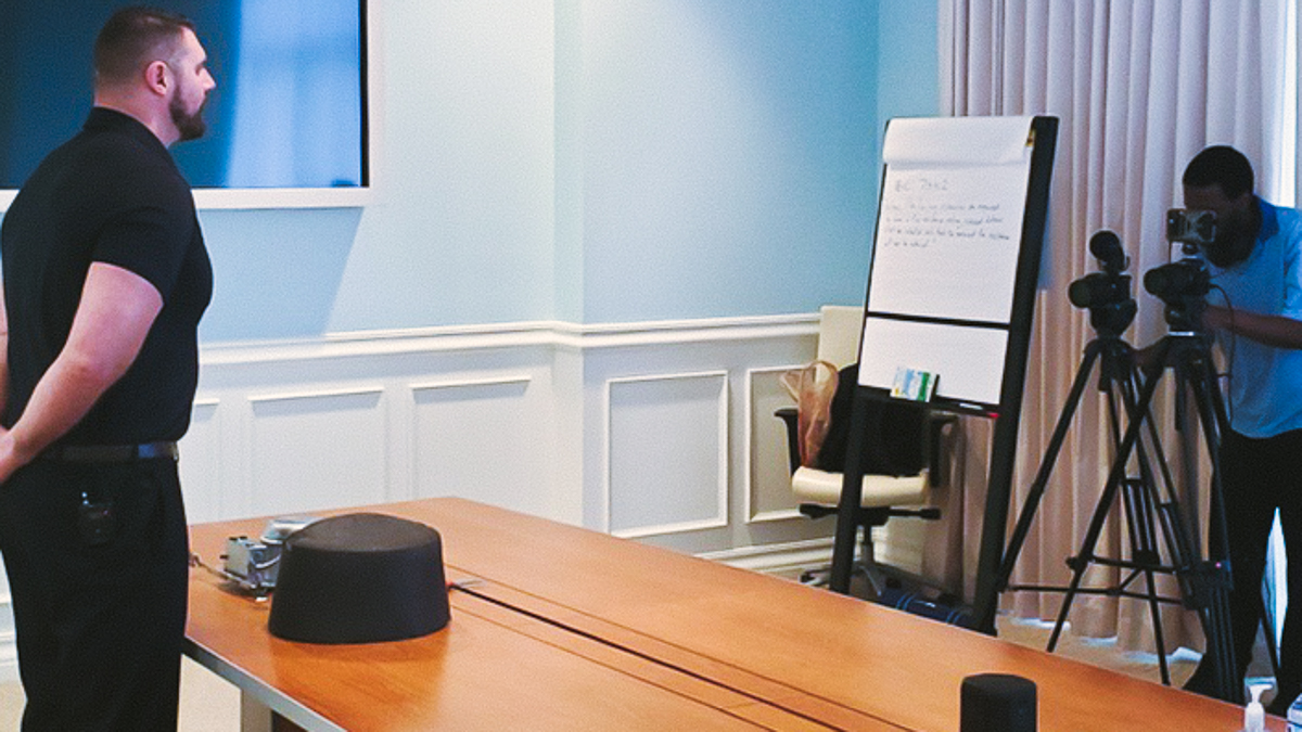 Orlando videographer filming a product training demonstration with two cameras in a conference room.