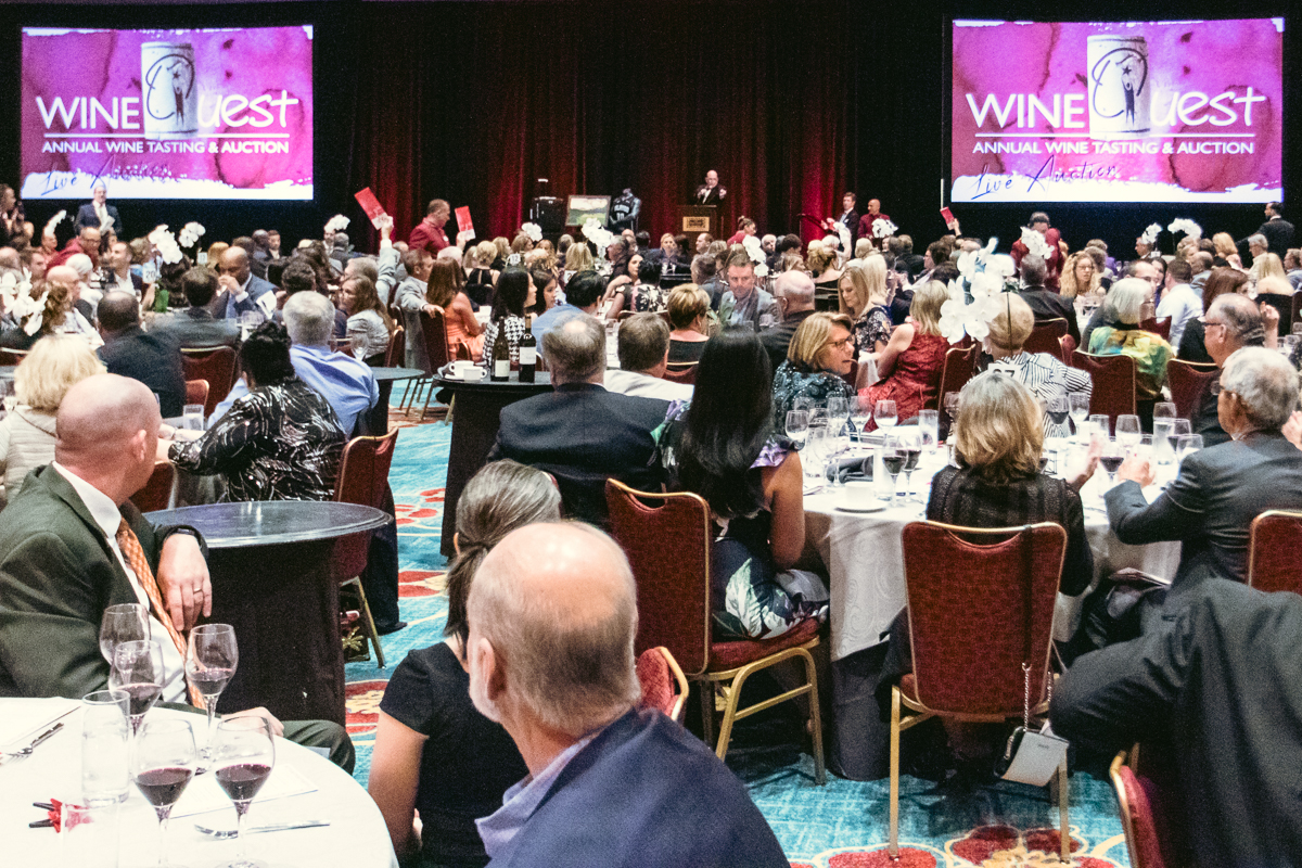 Guests attending the wine quest fundraising auction at loews royal pacific resort in orlando.