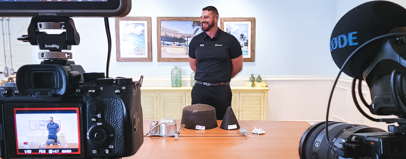 Two cameras filming a presenter during a training video at Margaritaville Resort Orlando.