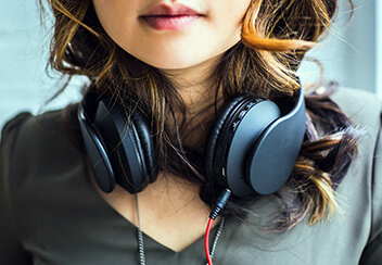Woman modeling headphones for product launch