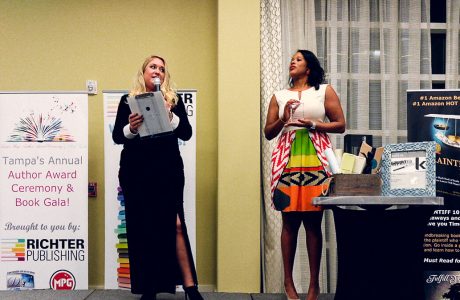 Two women presenting at richter publishing's annual author award ceremony and book gala
